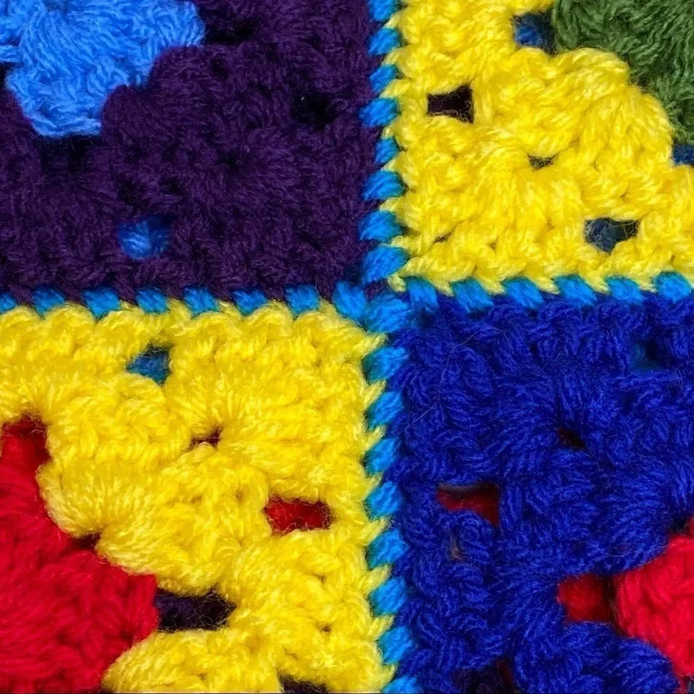 Hand crocheted bright multi colored Afghan size 56” X 31”